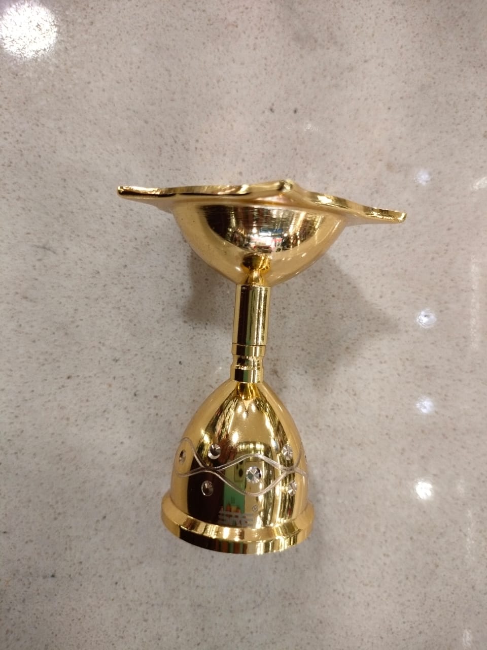 Golden Brass Star-Shaped Diya with Decorative Base
