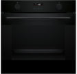 Black oven with digital display on a black background