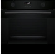 Black oven with digital display on a black background