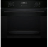 Black oven with digital display on a black background