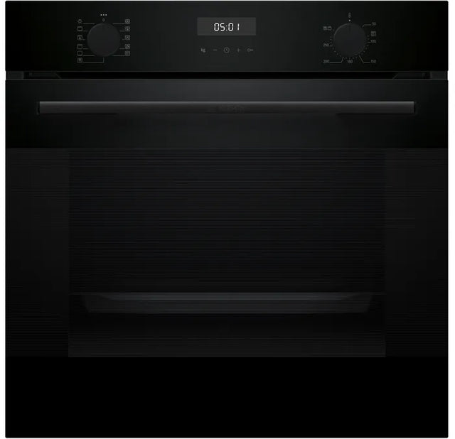 Black oven with digital display on a black background