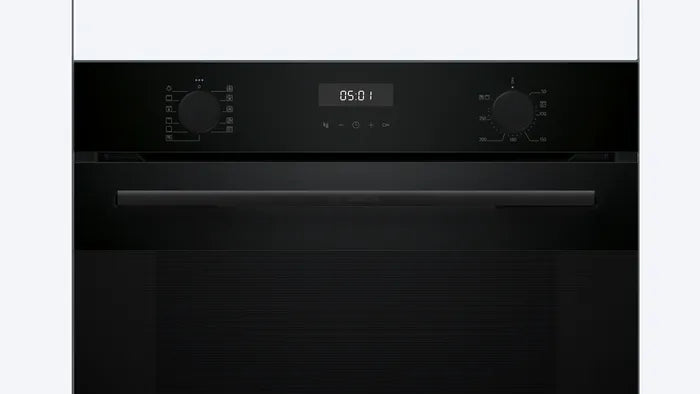 Black oven with digital display on a white background