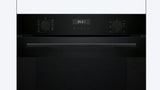 Black oven with digital display on a white background